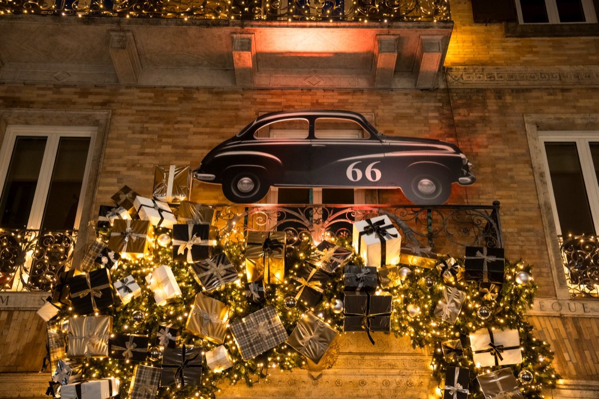 Christmas façade with vintage car and gift boxes