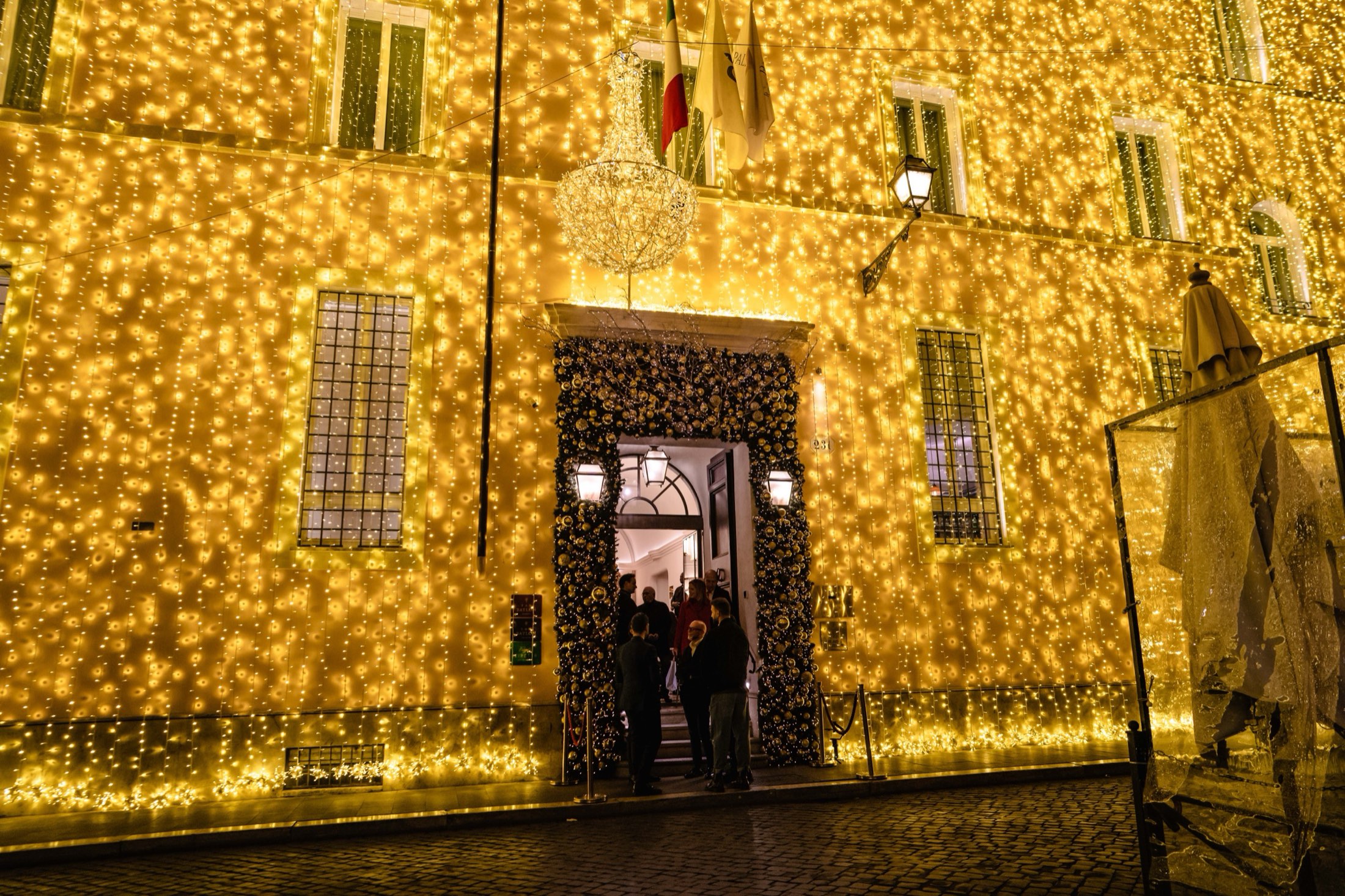 Palazzo façade lit by thousands of golden lights